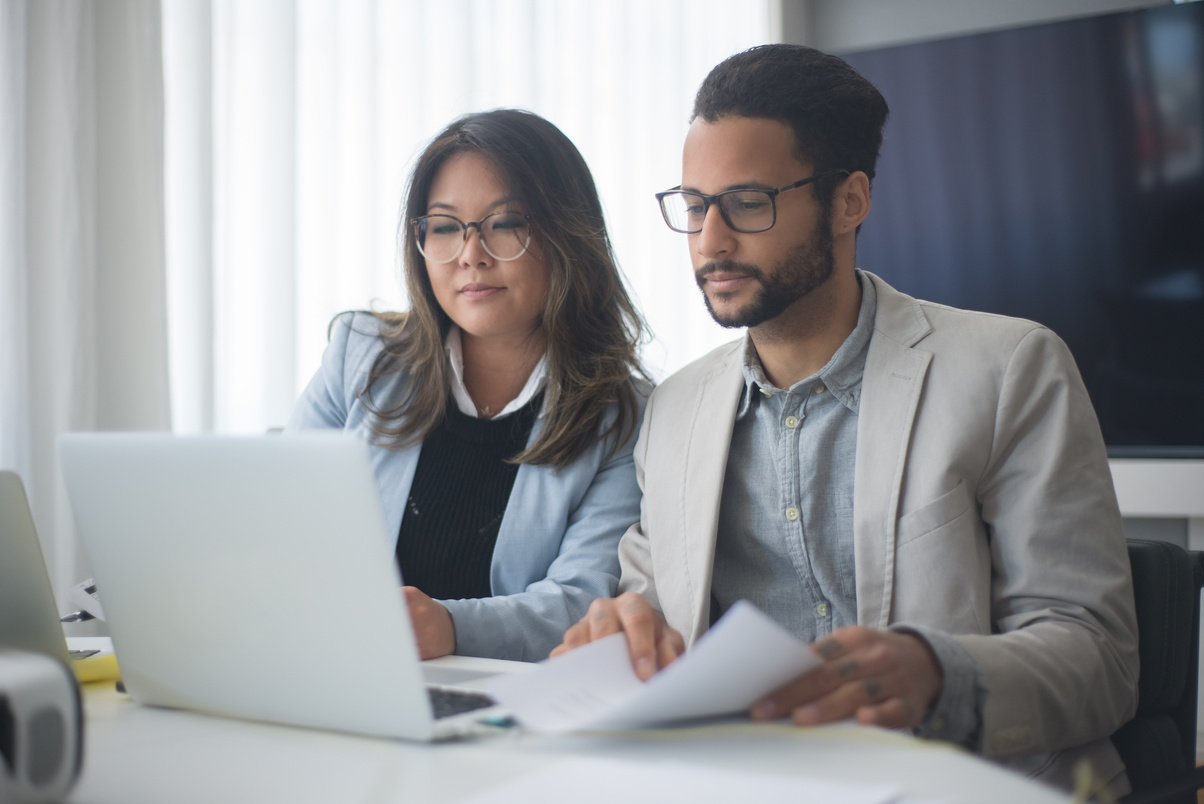 A Man and a Woman Collaborating in Business