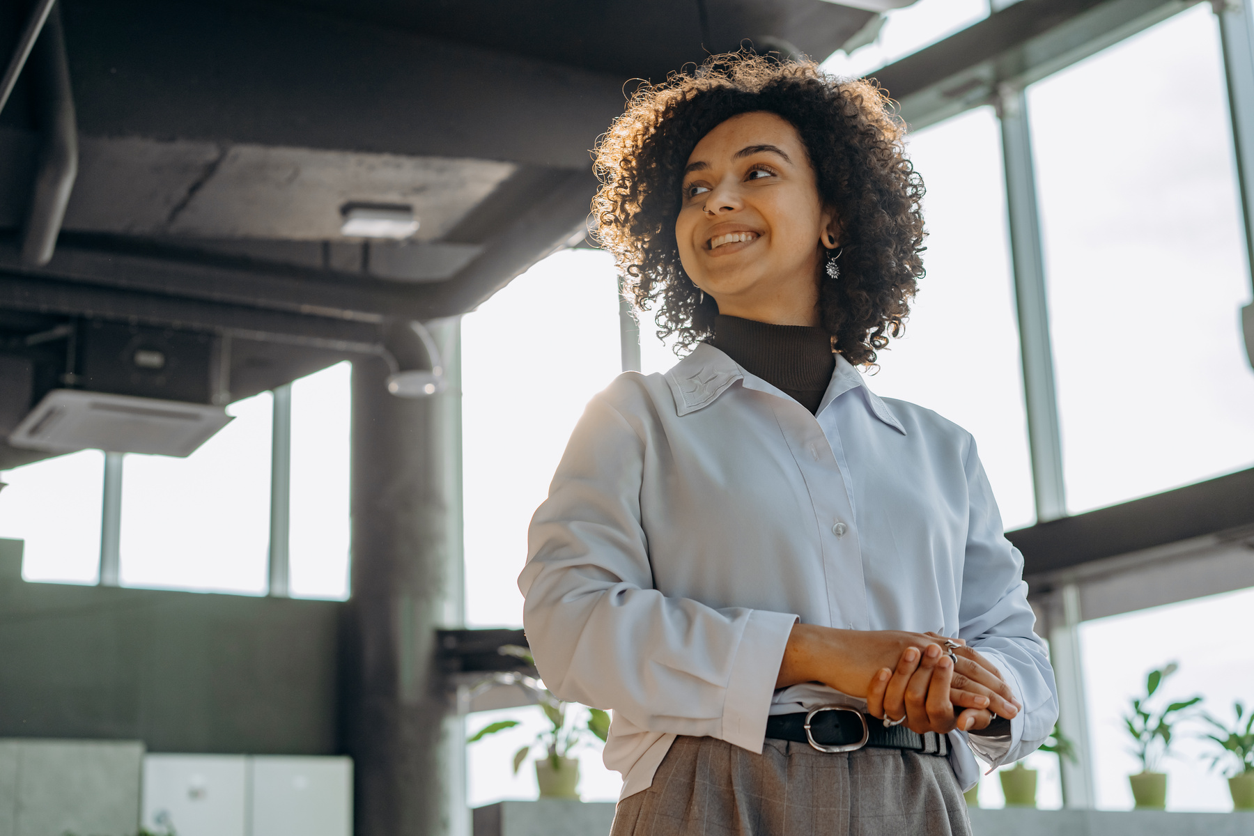 A Woman In White Long Sleeves Working in an Office